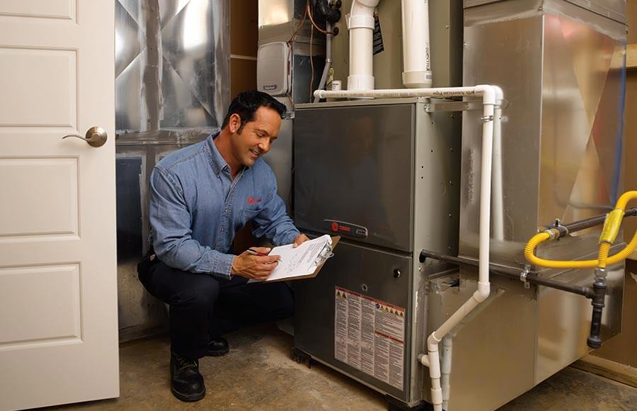 Tech checking unit, heating repair and installation services